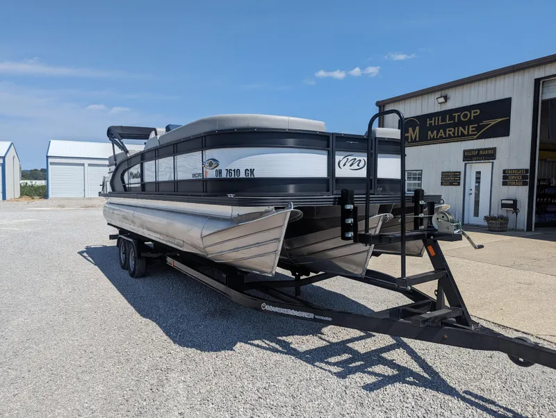 Slide: The Image of 2022 Manitou Encore 25 RF pontoon boat on trailer at Hilltop Marine. - 4