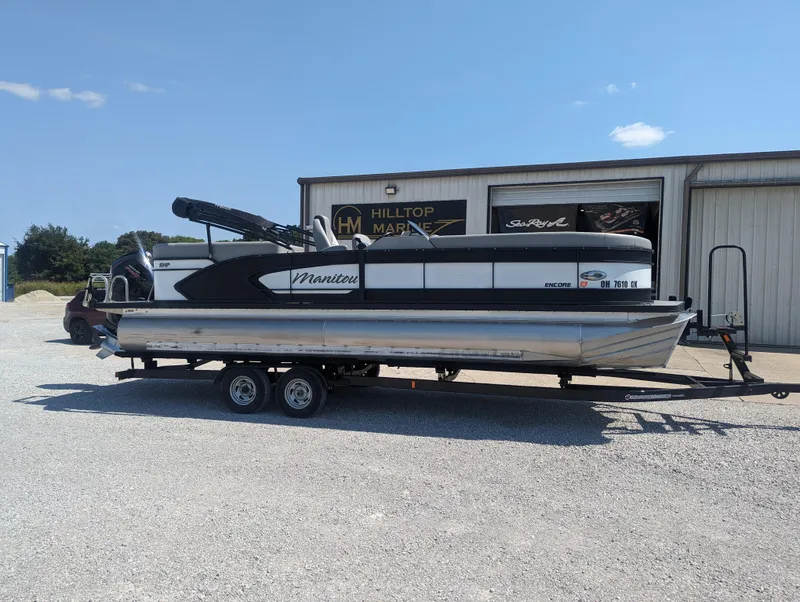 Slide: The Image of 2022 Manitou Encore 25 RF pontoon boat on trailer at Hilltop Marine. - 5