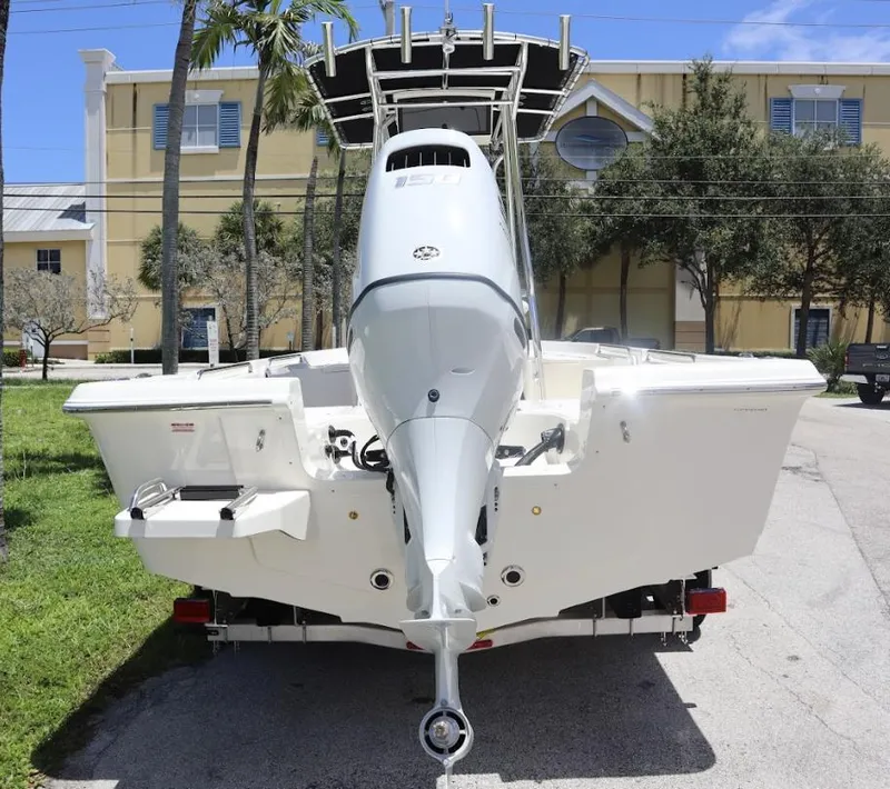Slide: The Image of 2025 Bulls Bay 2200 boat with outboard motor, parked on a trailer. - 3