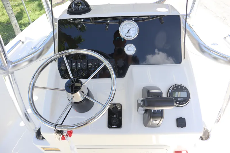 Slide: The Image of Bulls Bay 2200 boat dashboard with steering wheel and controls, 2025 model. - 6