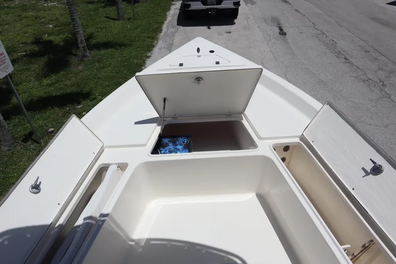 Slide: The Image of 2025 Bulls Bay 2200 boat with open storage compartments on deck. - 8