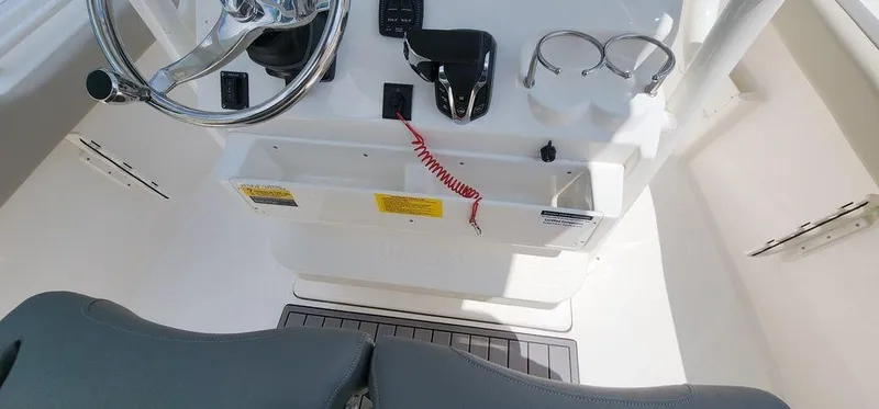 Slide: The Image of 2025 Key West 239 FS boat console with steering wheel and controls. - 12