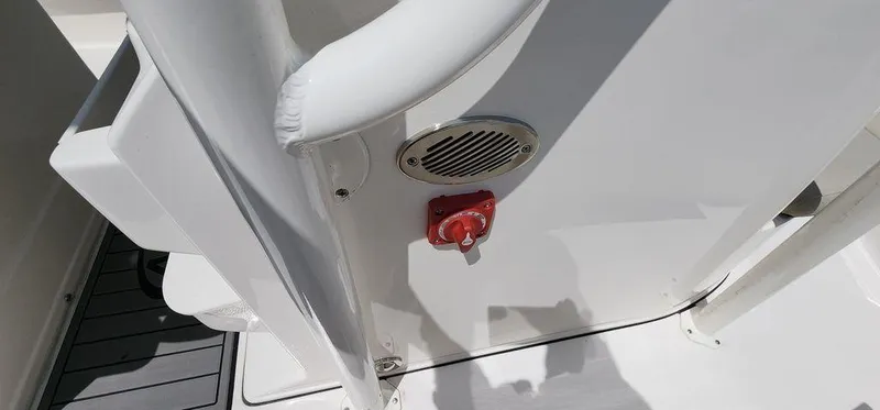 Slide: The Image of Key West 239 FS 2025 boat interior with speaker and red switch. - 14