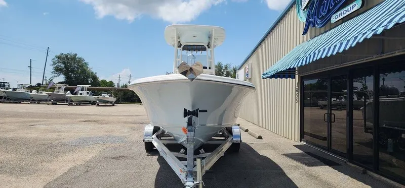 Slide: The Image of 2025 Key West 239 FS boat on trailer outside dealership. - 2