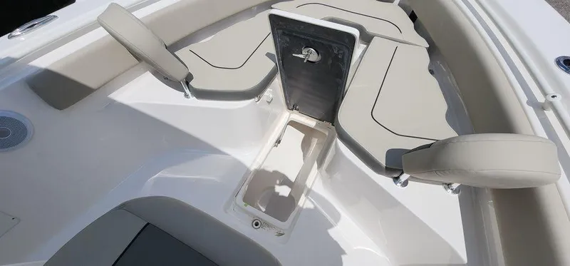Slide: The Image of 2025 Key West 239 FS boat interior with open storage compartment and cushioned seating. - 21