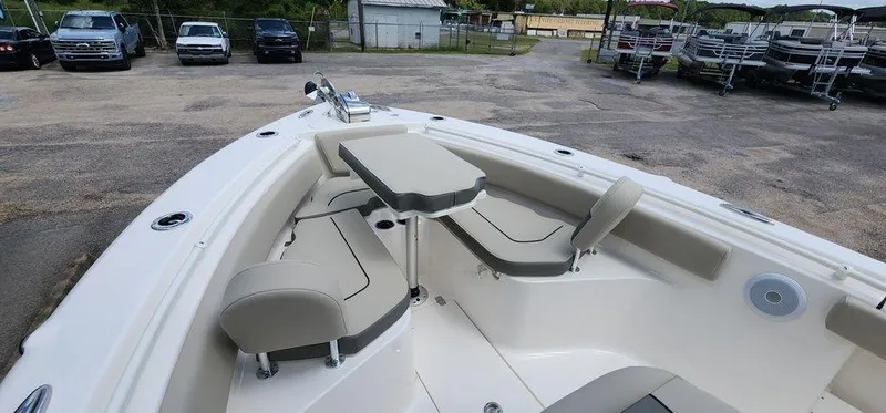 Slide: The Image of 2025 Key West 239 FS boat with seating and table in the bow area. - 22