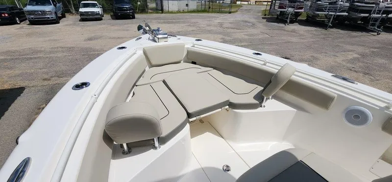 Slide: The Image of 2025 Key West 239 FS boat interior with beige seating and spacious layout. - 23