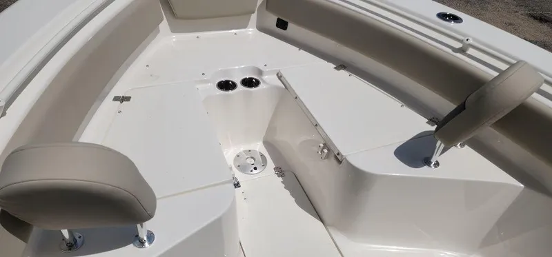 Slide: The Image of 2025 Key West 239 FS boat interior with seating and cup holders. - 24