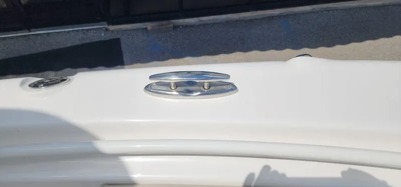 Slide: The Image of 2025 Key West 239 FS boat cleat on white deck. - 33