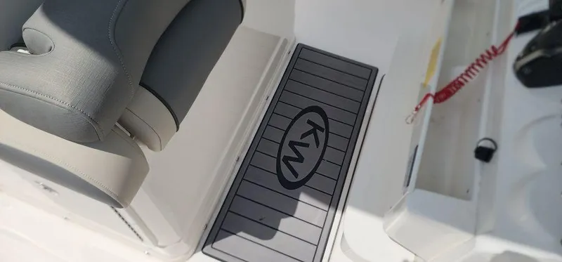Slide: The Image of 2025 Key West 239 FS boat interior with KW logo mat and seating. - 34