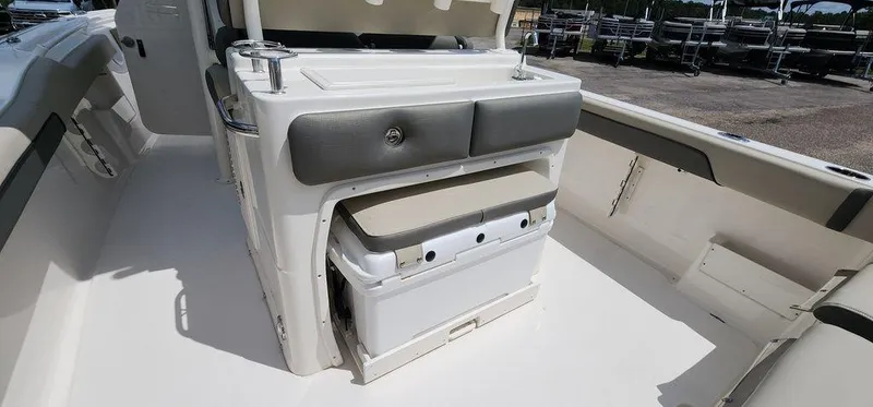 Slide: The Image of 2025 Key West 239 FS boat interior with seating and storage. - 45