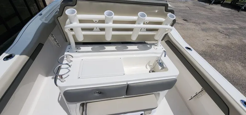 Slide: The Image of 2025 Key West 239 FS boat interior with rod holders and sink. - 46