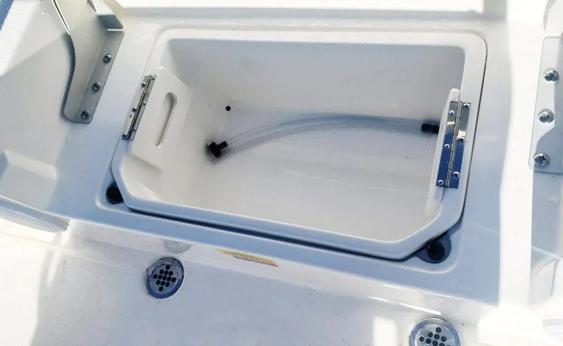 Slide: The Image of 2025 Key West 239 FS boat storage compartment with drainage system. - 8