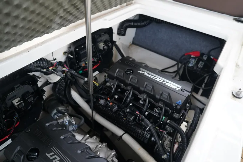 Slide: The Image of 2021 Yamaha Boats 252SE engine compartment showcasing powerful motor and wiring. - 24
