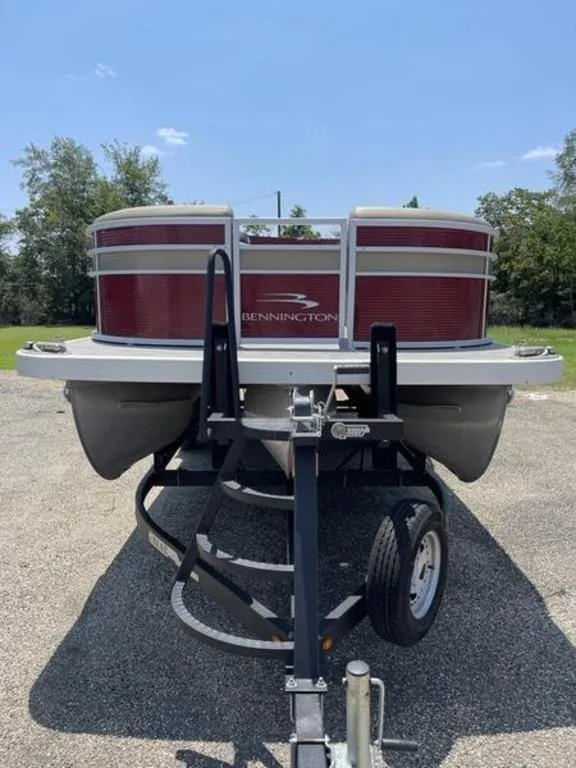 Slide: The Image of 2021 Bennington 22 SSBX pontoon boat on trailer, sunny day. - 14