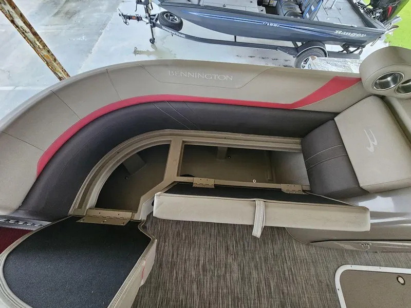 Slide: The Image of 2021 Bennington 22 SSBX pontoon boat interior with open storage compartment. - 25