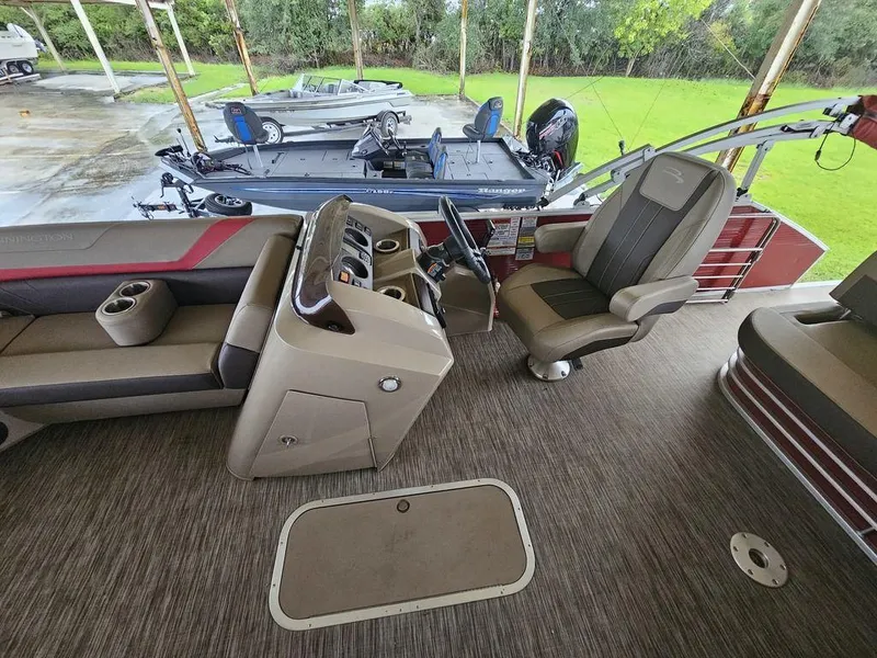 Slide: The Image of 2021 Bennington 22 SSBX pontoon boat interior with seating and control console. - 42