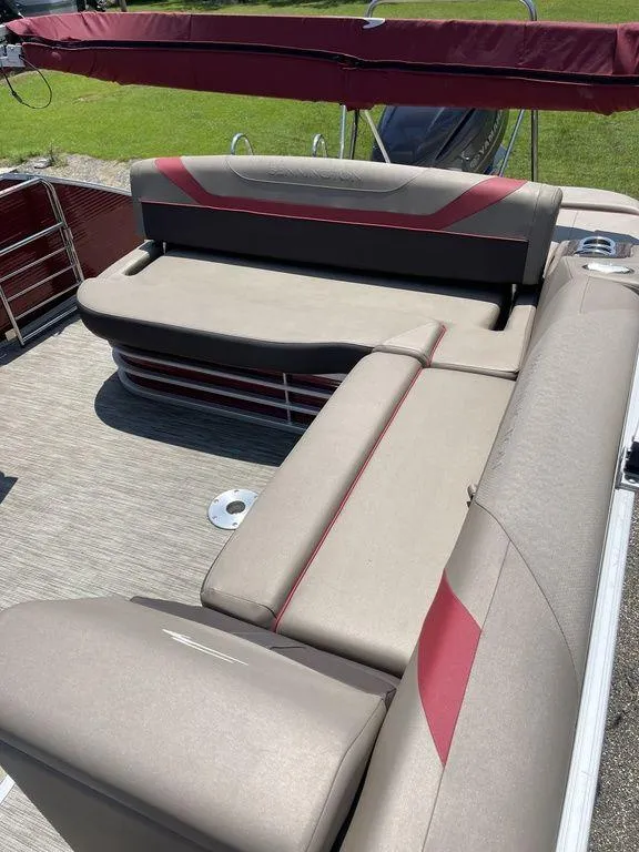 Slide: The Image of 2021 Bennington 22 SSBX boat interior with beige and red seating. - 7