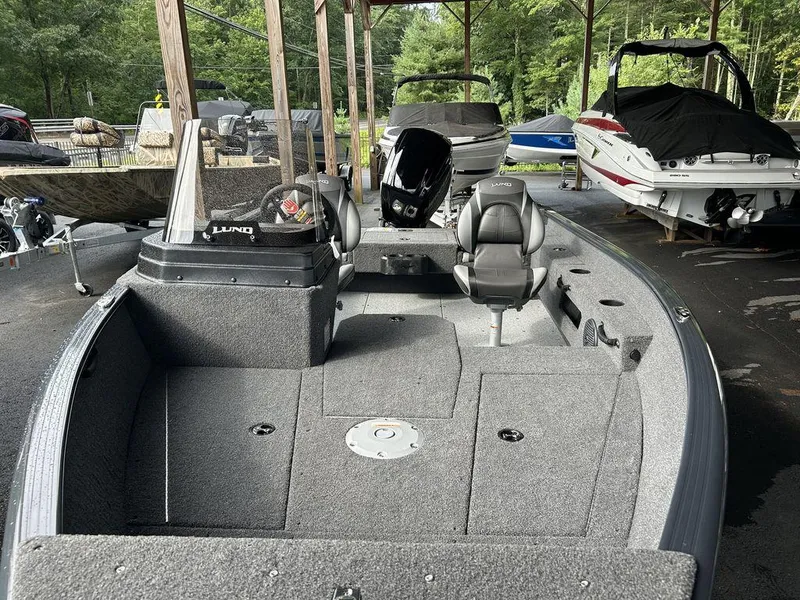 Slide: The Image of 2025 Lund ADVENTURE 1675 SS fishing boat in covered storage area. - 3