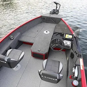 Slide: The Image of 2025 Lund ADVENTURE 1675 SS boat interior with steering console and seating on water. - 8