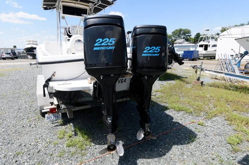 Slide: The Image of 1994 Contender 25 Tournament boat with twin 225 Mercury outboard engines. - 12