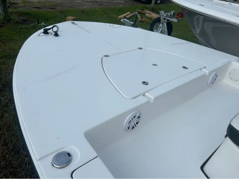 Slide: The Image of 2025 Tidewater 25 TPC Raptor boat deck with storage compartments and speakers. - 16