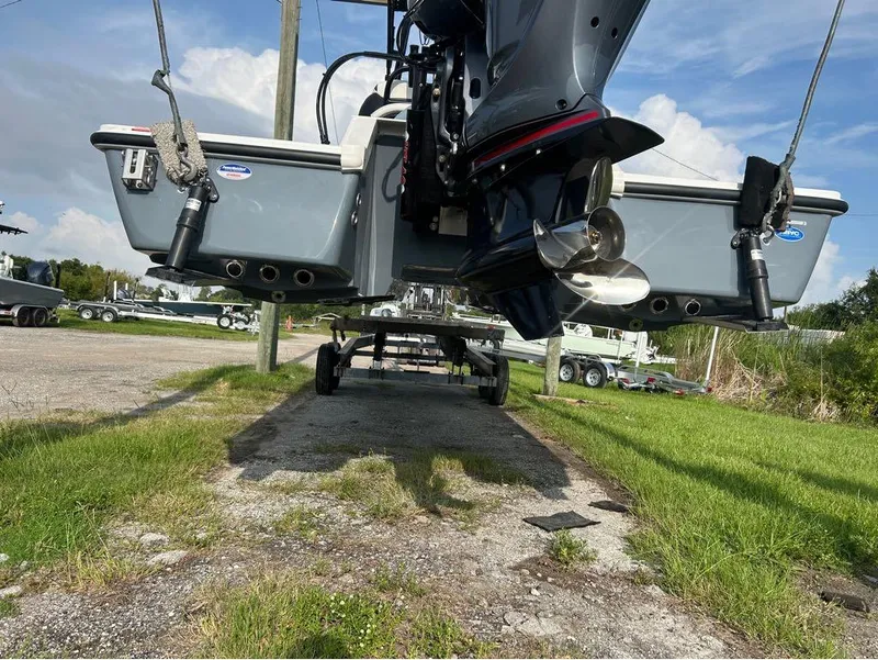 Slide: The Image of 2025 Tidewater 25 TPC Raptor boat on trailer, rear view with motor and propeller. - 8