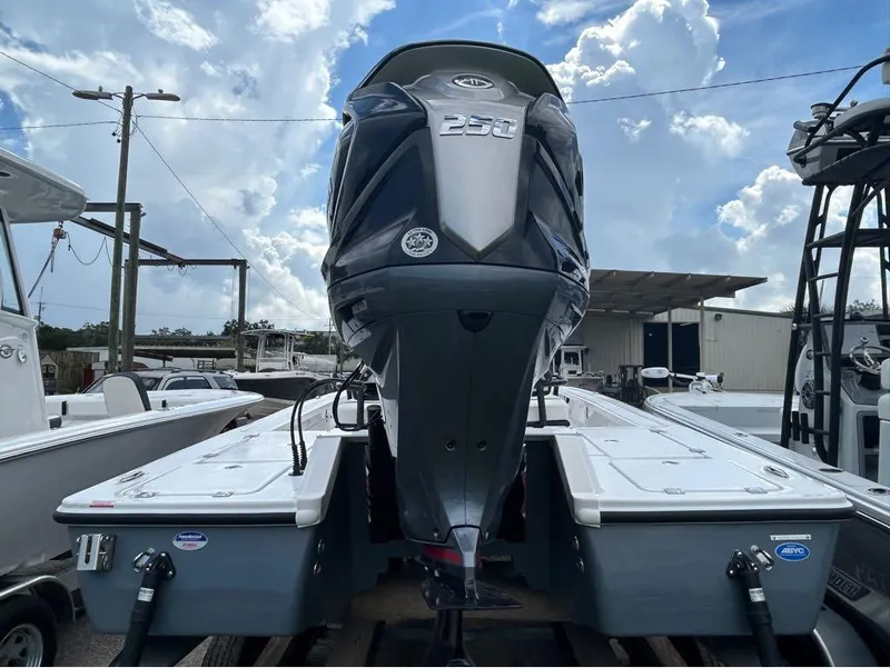 Slide: The Image of 2025 Tidewater 25 TPC Raptor boat with powerful 250 engine, parked outdoors. - 9