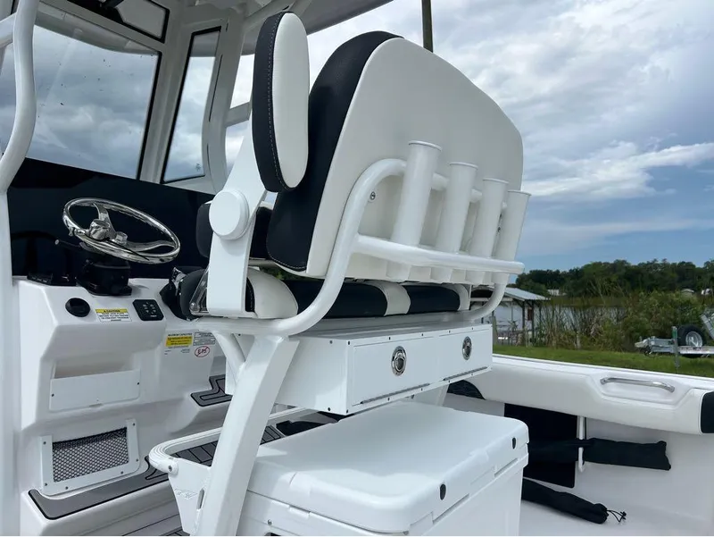 Slide: The Image of 2025 Tidewater 2500 Carolina Bay boat interior with helm and seating. - 13