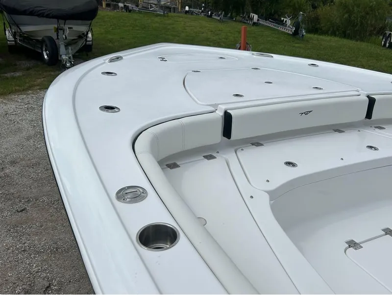 Slide: The Image of 2025 Tidewater 2500 Carolina Bay boat, white deck, sleek design, fishing rod holders. - 3