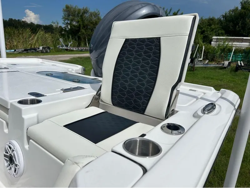 Slide: The Image of 2025 Tidewater 2500 Carolina Bay boat seat with cup holders and sleek design. - 4
