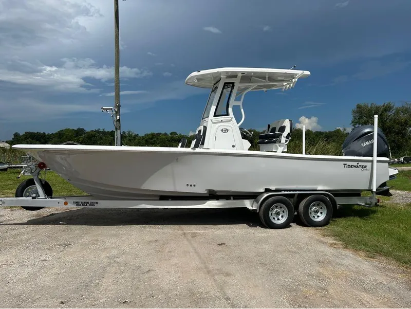 Slide: The Image of 2025 Tidewater 2500 Carolina Bay boat on trailer under cloudy sky. - 7