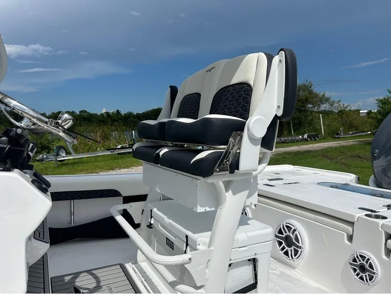 Slide: The Image of 2025 Tidewater 2500 Carolina Bay boat interior with dual seats and console. - 9