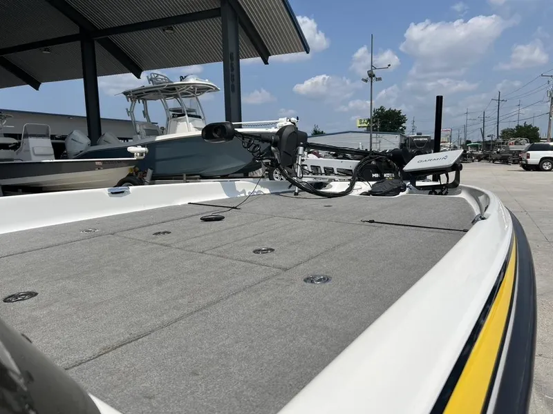 Slide: The Image of 2010 Bass Cat Pantera IV boat with Garmin equipment, parked under a canopy. - 11