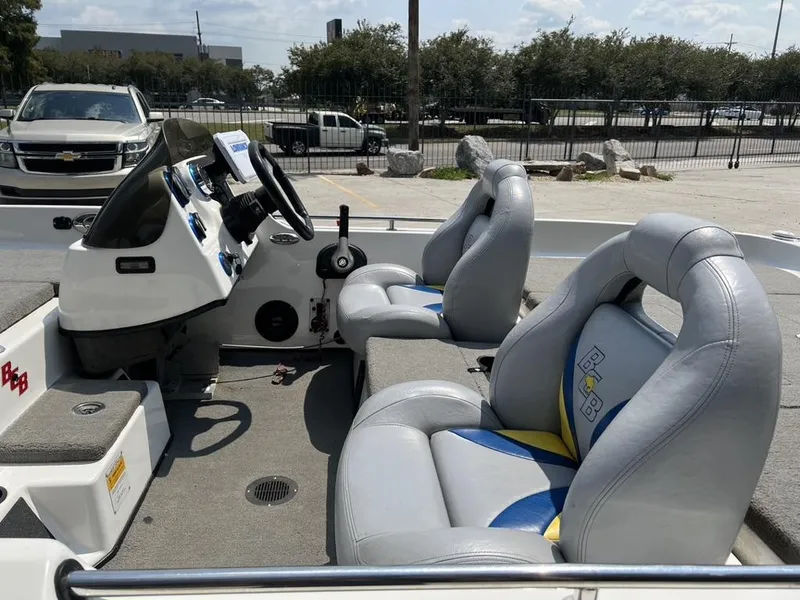 Slide: The Image of 2010 Bass Cat Boats Pantera IV interior with dual seats and steering console. - 7