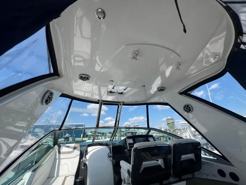 Slide: The Image of Interior view of 2017 Monterey 355 Sport Yacht cockpit with clear sky background. - 14