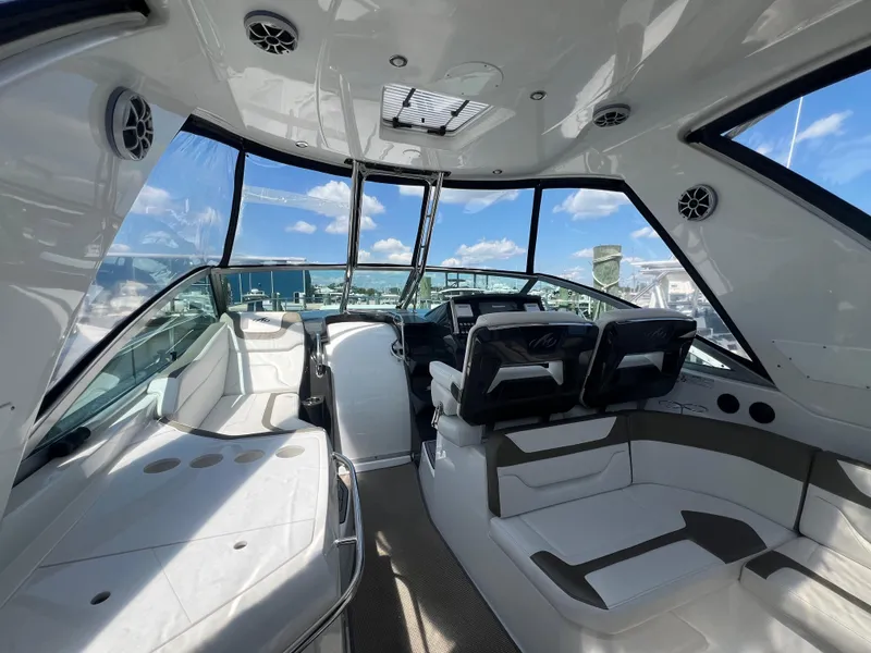 Slide: The Image of Interior of 2017 Monterey 355 Sport Yacht with modern seating and dashboard. - 15