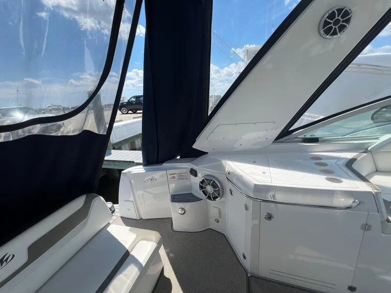 Slide: The Image of Interior view of 2017 Monterey 355 Sport Yacht with seating and control panel. - 16