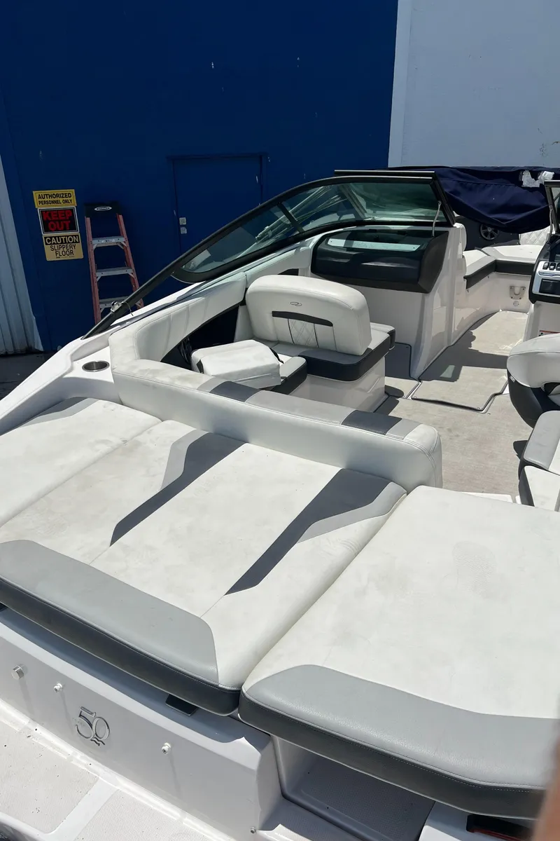 Slide: The Image of 2021 Regal 21 OBX boat with spacious seating and sleek design. - 14