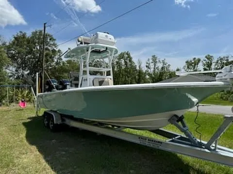 Slide: The Image of 2024 Tidewater 2700 Carolina Bay boat on trailer, parked outdoors. - 0