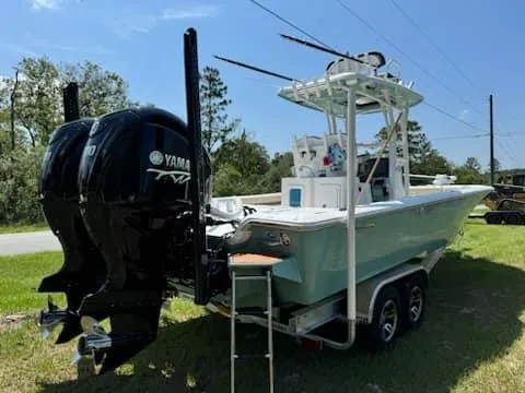 Slide: The Image of 2024 Tidewater 2700 Carolina Bay boat on trailer with Yamaha engines. - 1