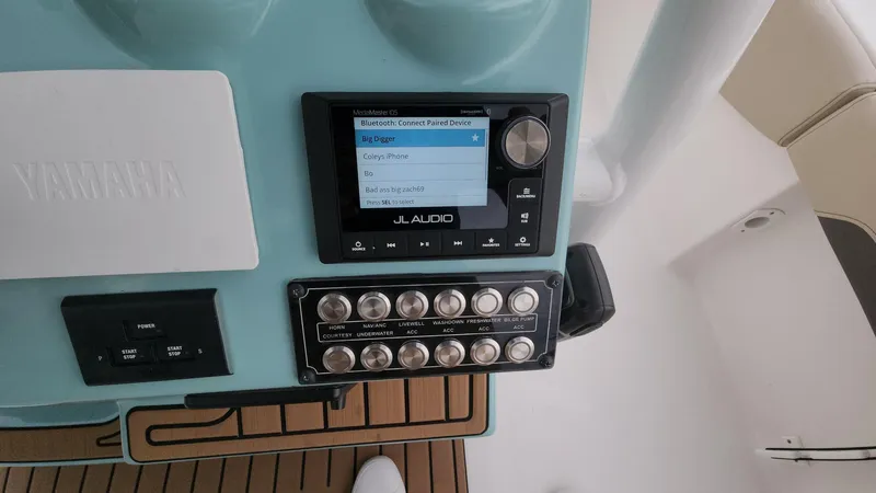 Slide: The Image of Control panel of 2024 Tidewater 2700 Carolina Bay boat with JL Audio system. - 10