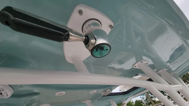 Slide: The Image of Close-up of a 2024 Tidewater 2700 Carolina Bay boat handle and structure. - 13