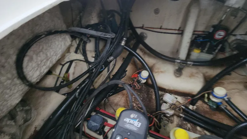 Slide: The Image of 2024 Tidewater 2700 Carolina Bay boat wiring and engine compartment details. - 15