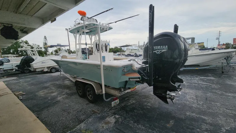 Slide: The Image of 2024 Tidewater 2700 Carolina Bay boat with Yamaha engine on a trailer. - 23