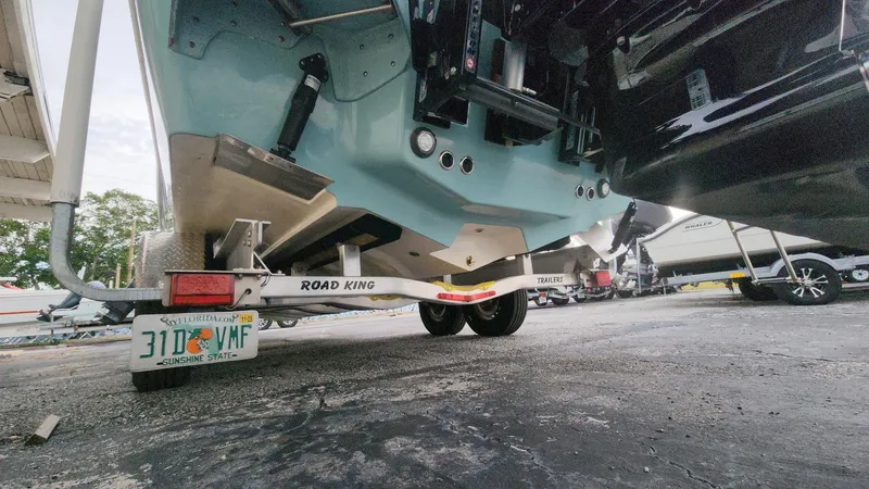 Slide: The Image of 2024 Tidewater 2700 Carolina Bay boat on Road King trailer, rear view. - 24