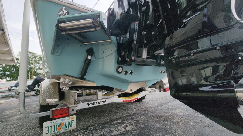 Slide: The Image of 2024 Tidewater 2700 Carolina Bay boat on Road King trailer, rear view. - 26