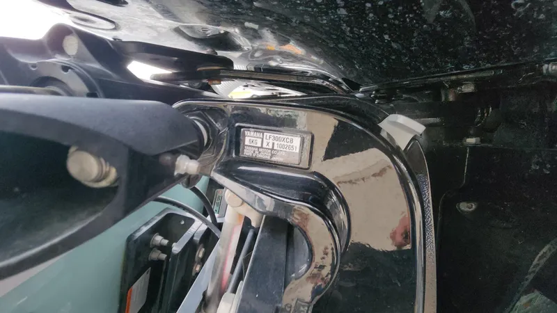 Slide: The Image of Close-up of a 2024 Tidewater 2700 Carolina Bay boat engine component. - 27