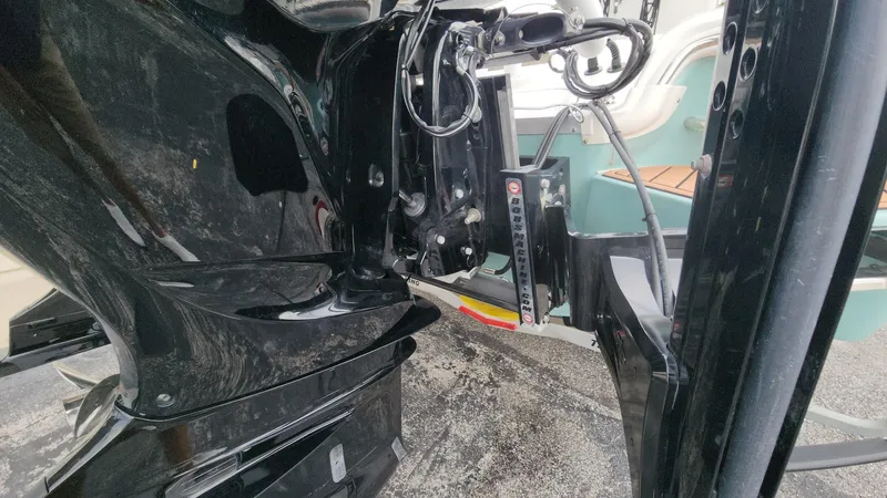 Slide: The Image of 2024 Tidewater 2700 Carolina Bay boat engine and transom detail. - 30