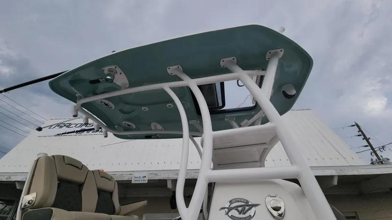 Slide: The Image of 2024 Tidewater 2700 Carolina Bay boat with T-top and seating, viewed from below. - 34